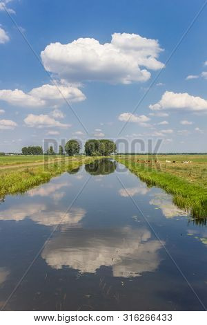 Littlle River Dwingelerstroom With Clouds Reflecting In The Water In Drenthe, Netherlands