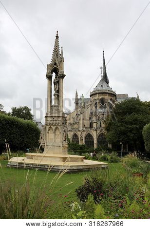 Public Park Behind The Basilica Of Notre Dame De Paris Before The Devastating Fire And The Bell Towe