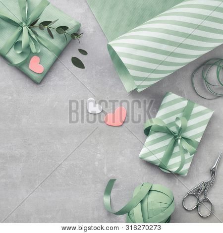 Springtime Flat Lay With Giift Boxes, Decorative Hearts And Eucalyprus Leaves. Square Composition Wi