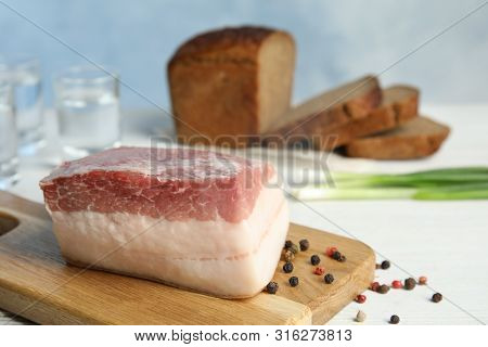 Composition With Pork Fatback On White Table. Space For Text