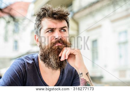 Waiting And Tinking. Bearded Man Feel Loneliness. Brutal Male Needs Barber. Thoughtful Man Outdoor. 