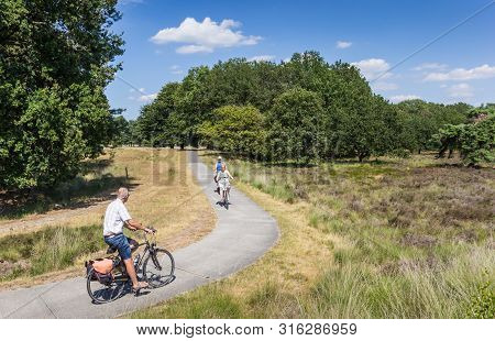 Dwingelderveld, Netherlands - July 30, 2019: People Riding Bicycles In National Park Dwingelderveld,