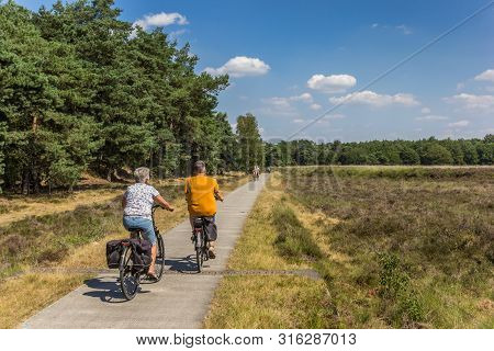 Dwingelderveld, Netherlands - July 30, 2019: People Riding Their Bicycle In National Park Dwingelder