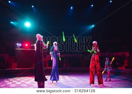 The Performance Of Stilt-walkers In The Circus
