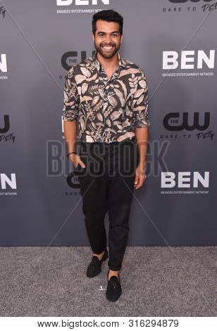 LOS ANGELES - AUG 04:  Anand Desai-Barochia arrives for the CW's Summer TCA All Star Party on August 04, 2019 in Beverly Hills, CA                