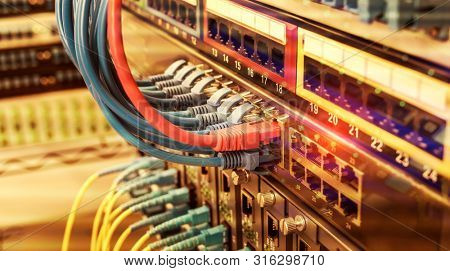 network cable connecting on network core switch close up