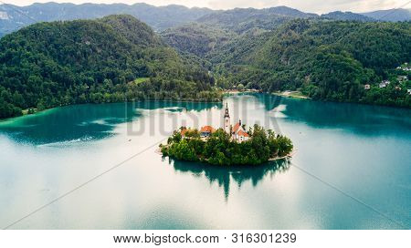 Bled, Slovenia. Aerial Drone View Of Lake Bled With The Pilgrimage Church Of The Assumption Of Maria