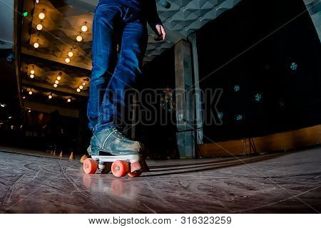People Skating On Roller Rink. Roller Skating At Rollerdrome