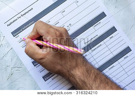 Hand Filling Standard Application For Employment. Hr, Hiring, Applicant Filling Job Application. Hr,