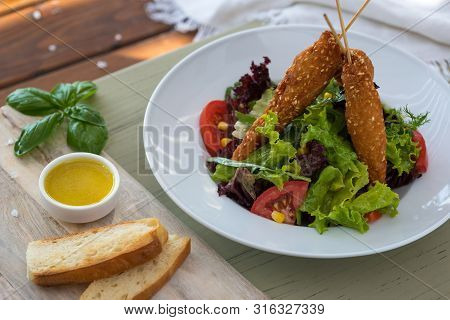 Fried Chicken On Wooden Skewers With Vegetable Salad And Sauce. Spring Picnic, ,. Delicious Lunch. O