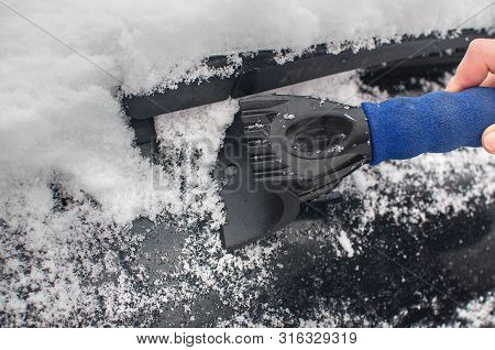 Scraping Ice And Snow From The Car Window. Hand Scraping Ice Or Snow From Car Windscreen, Winter Pro