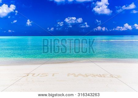 Just Married Written On Sand