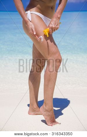Woman Applying Sunscreen