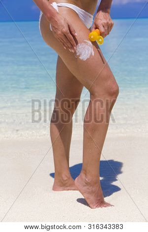 Woman Applying Sunscreen