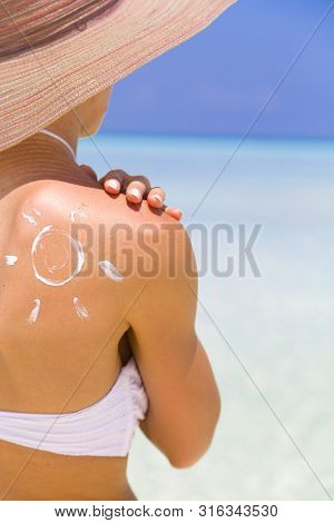 Sun Painted With Sunscreen On Shoulder To Make Aware About The Importance Of Protection When Going O