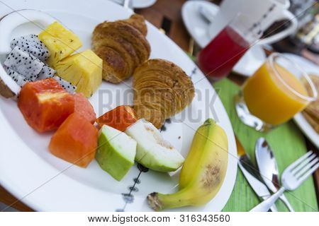 Breakfast With Tropical Fresh Fruit And Pancakes