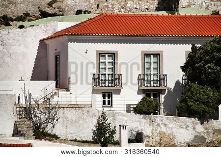 Azenhas Do Mar, Sintra, Lisbon, Portugal- March 19, 2019: Beautiful Narrow Streets, White Houses And