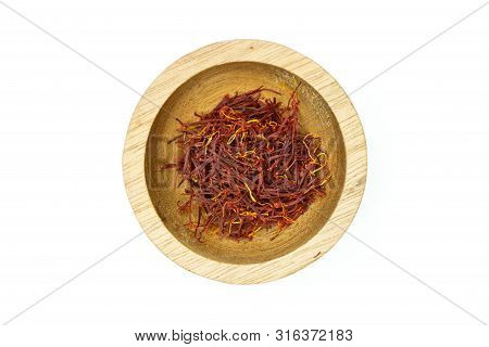 Lot Of Whole Dry Shaffron Thread In Wooden Bowl Flatlay Isolated On White Background