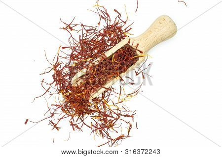 Lot Of Whole Dry Shaffron Thread With Wooden Scoop Flatlay Isolated On White Background