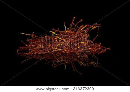Lot Of Whole Dry Shaffron Thread Isolated On Black Glass