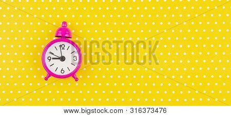 Flat Lay With Vintage Alarm Clock Over The Bastel Background
