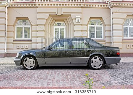 Kiev, Ukraine - September 6, 2013: Mercedes E500 W124 Wolf On The Background Of Beautiful Old Houses