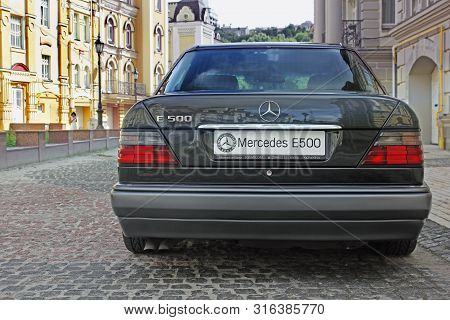 Kiev, Ukraine - September 6, 2013: Mercedes E500 W124 Wolf On The Background Of Beautiful Old Houses