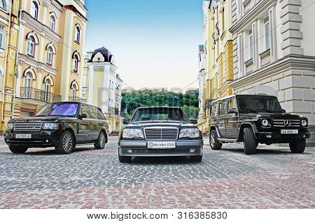 Kiev, Ukraine - September 6, 2013: Mercedes E500 W124 Wolf On The Background Of Beautiful Old Houses