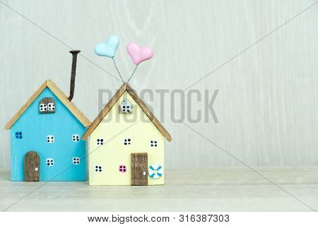 Real Estate Property Concept. Two Miniature Home, Minimal Driftwood Model Wood House On Table. Idea 