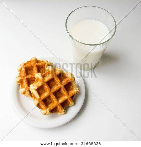 Glass Of Milk And Cookies On White Background