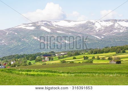 Mountains And Agricultural Area In Oppdal, Norway