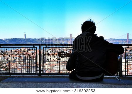 Lisbon, Portugal- March 21, 2019: Musician Playing Fado Music On A Viewpoint In Lisbon In The Mornin