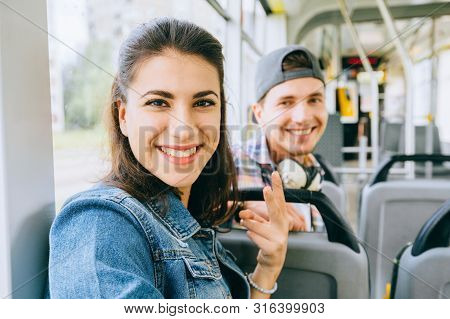 Young Smiling Multicultural Couple, Handsome Guy And Young Woman Talking While Sitting In The City T