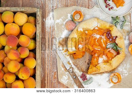 Homemade Fruit Pie Galette Made With Fresh Organic Apricotes With Powdered Sugar On Wooden Table, To