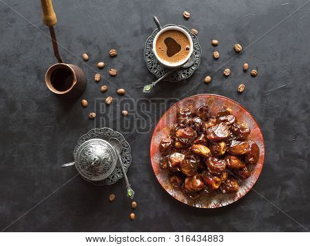 Organic Sweet Dates With Syrup And Black Coffee. Ramadan Kareem Holiday Concept. Top View.