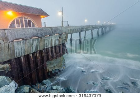 Pacifica Municipal Pier In Thick Fog And High Tide. Pacifica, San Mateo County, California, Usa.