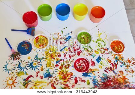 Pots With Colorful Dye Used For Fingerpainting. Indoor Creative Art For Kids