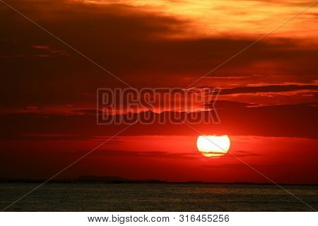 Sunset On Red Yellow Sky Back Soft Evening Cloud Over Horizon Sea