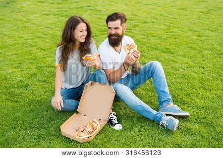 Fast Food Delivery. Bearded Man And Woman Enjoy Cheesy Pizza. Couple In Love Dating Outdoors With Pi