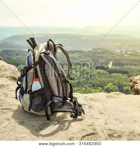 Hipster Hiker Tourist Backpack On Background Nature In Mountain, Blurred Panoramic Landscape, Travel