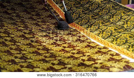 August 11 2019, Surakarta Indonesia : Close Up Hand To Make Batik On The Fabric With Canting With Bo