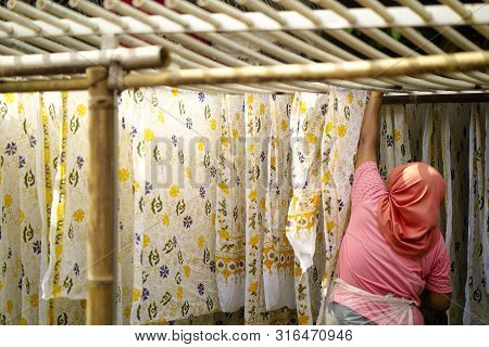 August 11 2019, Surakarta Indonesia : Close Up Hand To Make Batik On The Fabric With Canting With Bo