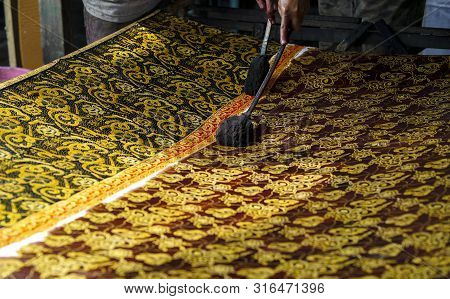 August 11 2019, Surakarta Indonesia : Close Up Hand To Make Batik On The Fabric With Canting With Bo