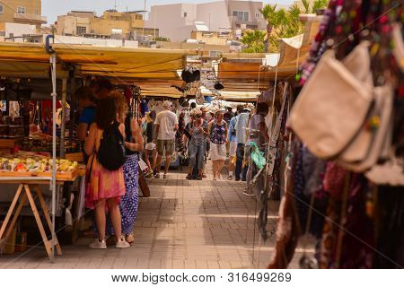 Marsaxlokk, Malta -5 May,2019: Tourist In Traditional Street Food Market In Marsaxlokk Which Is Hold