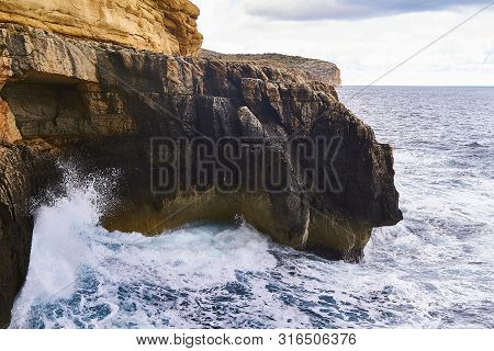 Huge Waves Crash On Cloudy Day. Kemmuna Island