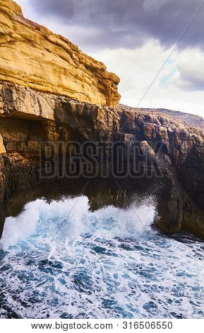 Huge Waves Crash On Cloudy Day. Kemmuna Island