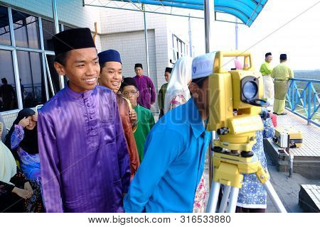 Labuan, Malaysia - Jun 27, 2014 : Muslim Looking Through The Theodolite To Observe Moon To Mark The 