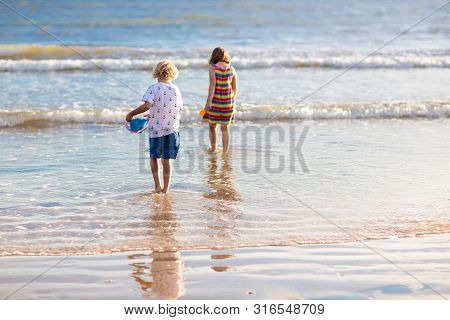 Kids Play On Tropical Beach. Sand And Water Toy.