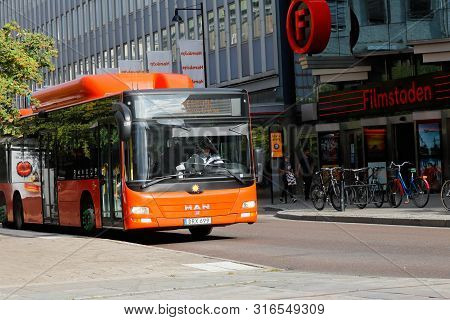 Karlstad, Sweden - August 7, 2019: A Orange Colored City Bus In Use For Public Transportation At Dro
