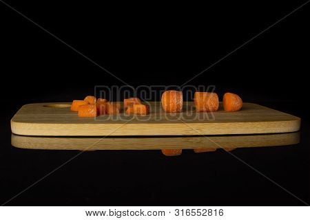 Group Of Three Quarters Lot Of Pieces Of Stale  Orange Stale Baby Carrot Baby On Chopping Board Isol